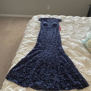 Floor length dress by Eliza J. Never worn. Purchased at Dillard’s. Size 10.